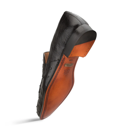 Black Mezlan Lisbon penny loafers. Ostrich quill texture, rounded toe, low stacked heel. Brown leather sole with contrast stitch. Branded insole.