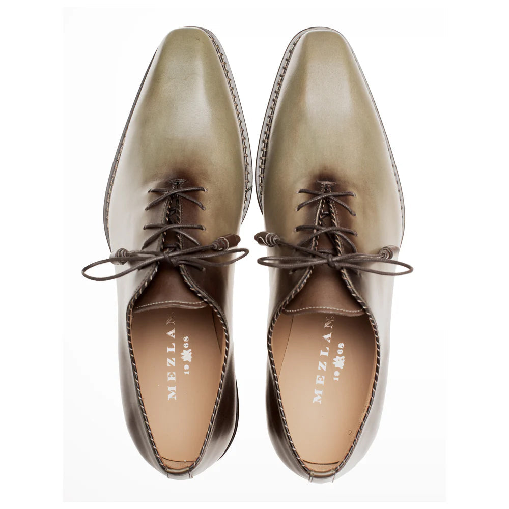 Mezlan Barbaro two-tone oxford. Elongated, pointed olive green toe to mocha brown heel. Lace-up with dark brown laces, tan interior lining. Prominent perimeter stitching.
