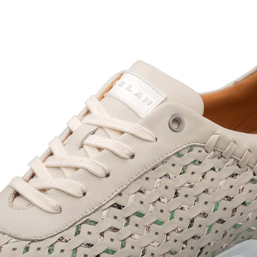 Mezlan Plata laser-cut sneaker: light green woven sides, cream leather upper. Rounded toe, matching laces. Branded tongue logo, metal eyelet. Light-colored sole.