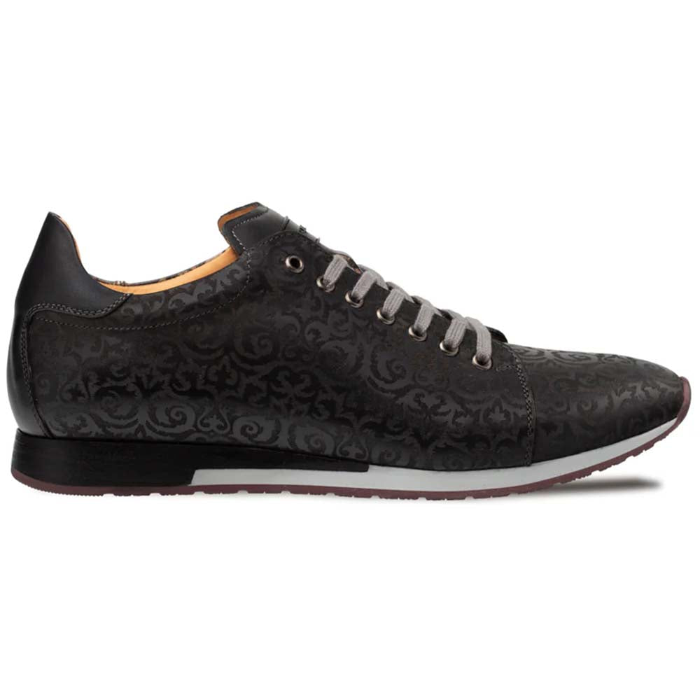 Mezlan Portico Laser Print Sneaker in black: low-profile silhouette with intricate laser-printed pattern. Rounded toe, white midsole. Lace-up front, gray laces. Solid black leather back.