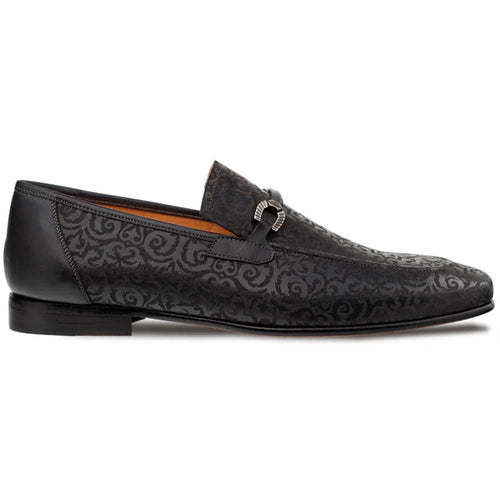 Mezlan Alcaraz slip-on: black, leather, laser-printed pattern. Elongated, low profile design with metal buckle. Slightly elevated sole for a sleek look.