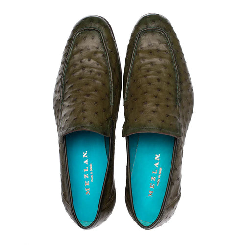 Olive green ostrich leather slip-on with elongated shape. Textured exterior, turquoise lining, and subtle stitching. Mezlan Menor style.