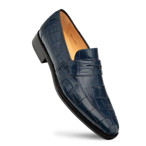 Mezlan Piccolo penny loafer in blue alligator. Slip-on design with a rounded profile and textured leather upper. Features a penny strap and a black rubber sole.