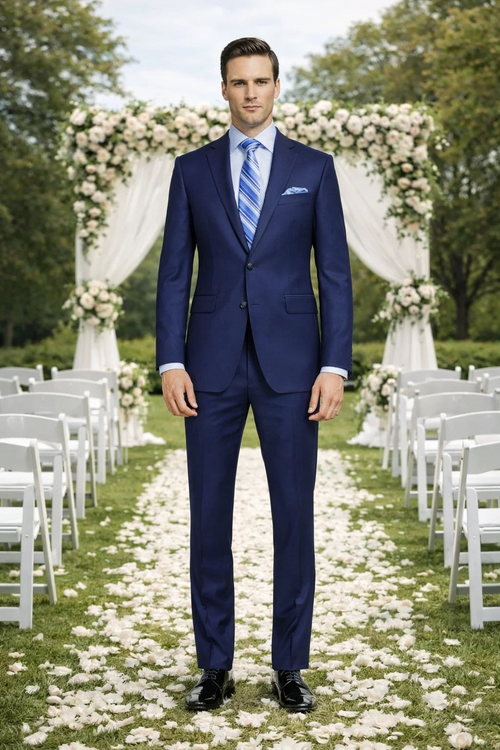 Dark blue, slim fit suit with modern styling. Two-button closure, notched lapel, and side pockets. Tailored silhouette for a sharp look.