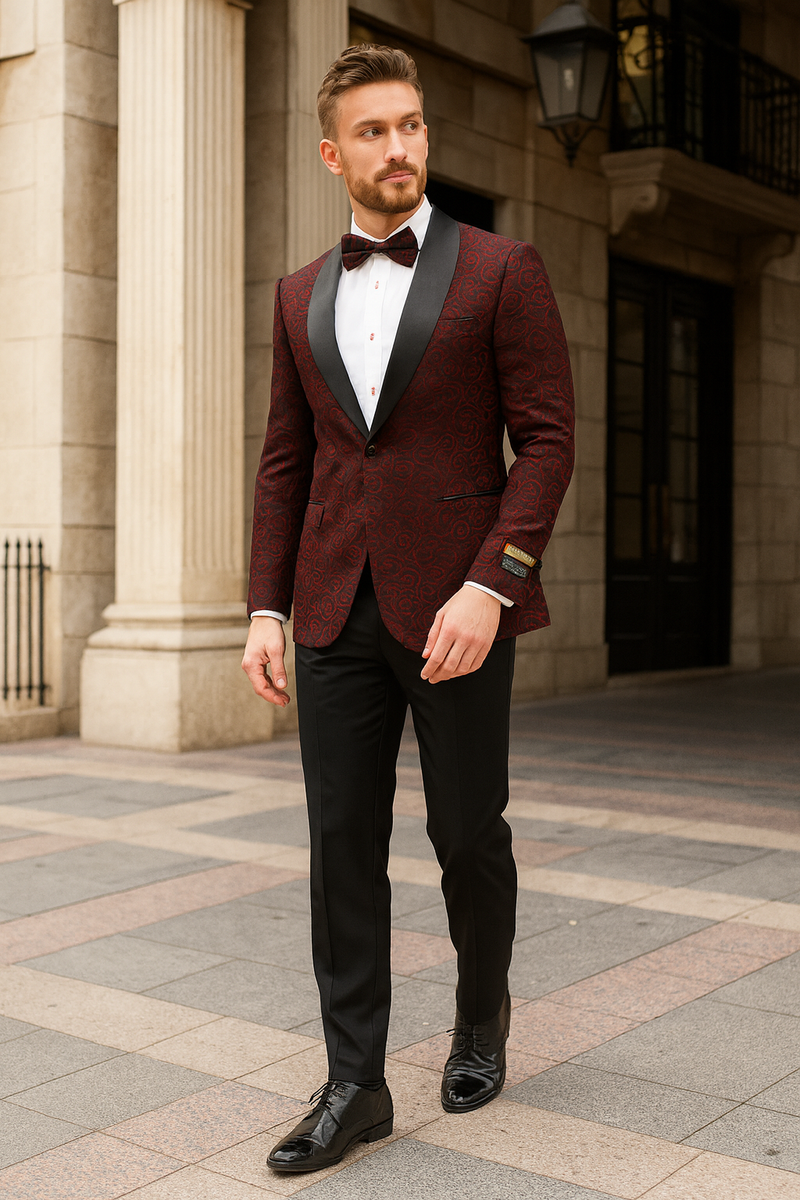 Burgundy paisley tuxedo jacket for men, slim fit with black satin lapel. Features burgundy paisley pattern, paired with a bowtie for a sophisticated look.