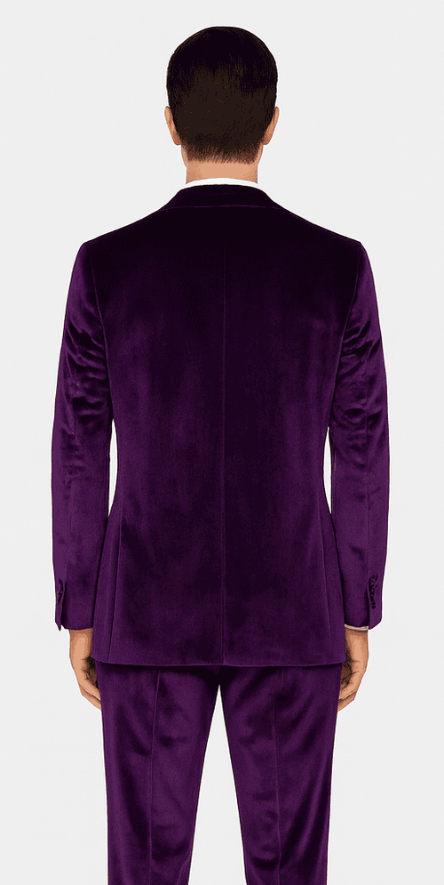 Purple velvet men's slim-fit suit. Two-piece tuxedo style: tailored jacket with notch lapel, matching trousers. Soft, luxurious velvet. Deep purple color, sleek silhouette.