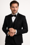Italian wool tuxedo. Modern fit, black. Fitted jacket with satin lapels, decorative beading. Matching trousers, waistcoat. Two front pockets, cuff buttons. Sleek, solid black design.