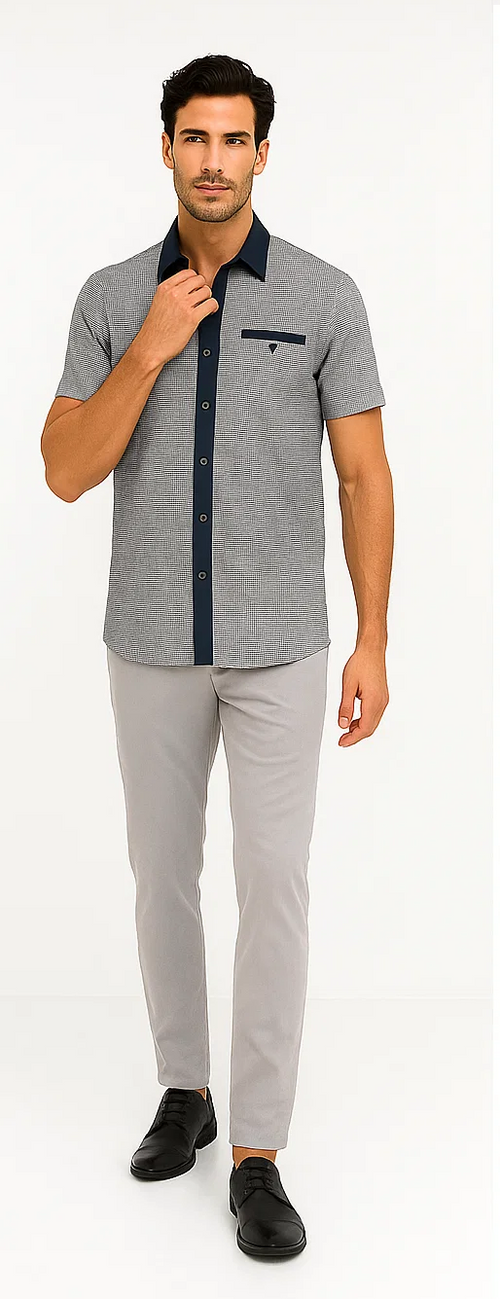 Navy & white houndstooth walking suit for men. Includes short-sleeve shirt with button closure, navy collar, chest pocket. Paired with light gray, slim-fit trousers.