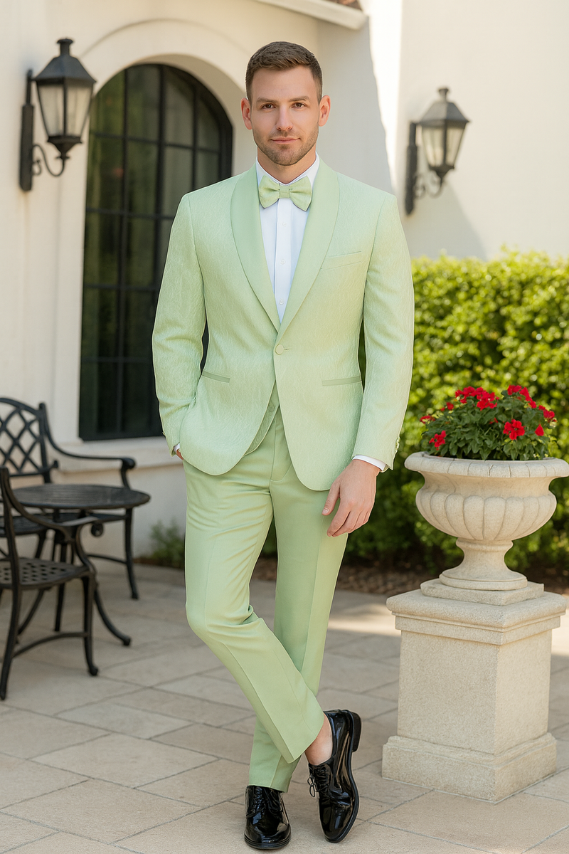 Mint green slim-fit tuxedo with shawl lapel. Includes tailored pants and a matching sage green bow tie. Smooth, subtly shiny fabric.