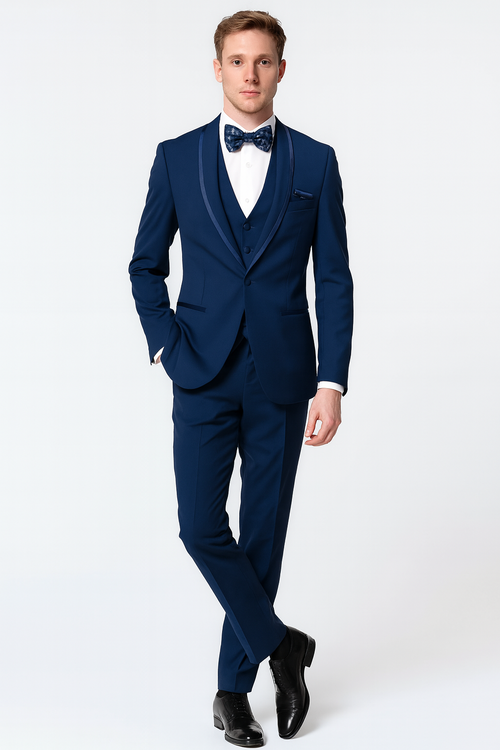 Navy three-piece tuxedo with satin shawl lapel & blue trim. Includes matching bow tie, white shirt & fitted silhouette. Finished with polished black shoes.