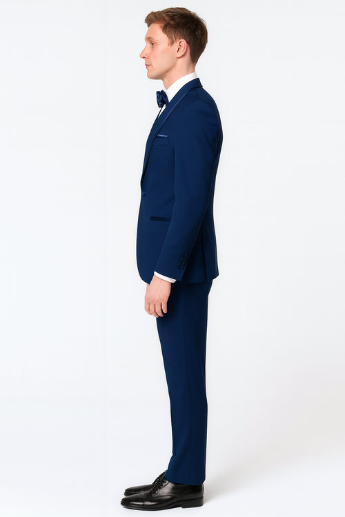 Navy blue three-piece tuxedo with satin shawl lapel, blue trim & bow tie. Features a fitted design, structured shoulders, and straight-cut trousers. Includes a matching vest for a formal, cohesive look.