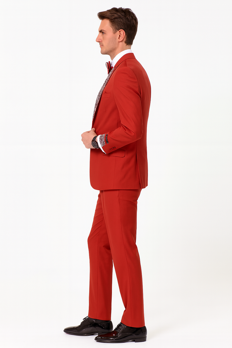 Striking red men's tuxedo with white lapel and sequins. Includes matching red pants and bow tie. Tailored fit and structured design for a bold, formal look.