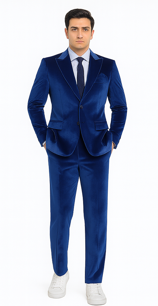 Royal blue velvet men's suit set. Slim fit, two-piece (jacket & trousers). Notched lapel, straight-cut trousers. Smooth, shiny texture. Paired with white sneakers. Deep royal blue.