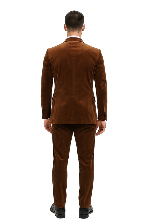 Men's brown velvet two-piece suit. Slim-fit formal blazer and pants set in rust copper. Smooth texture, tailored shape visible from the back.