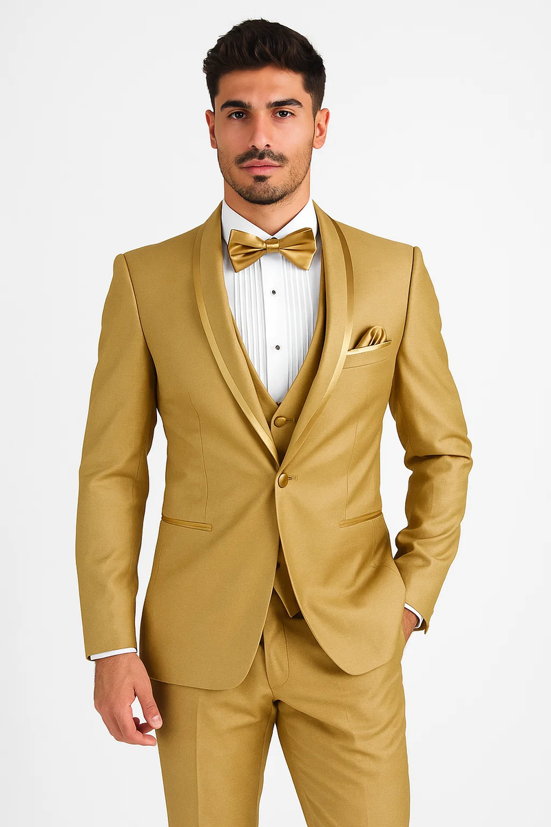 Men's gold champagne tuxedo with satin shawl collar and vested design. Includes white pleated shirt, gold bow tie, and pocket square. Fitted silhouette.