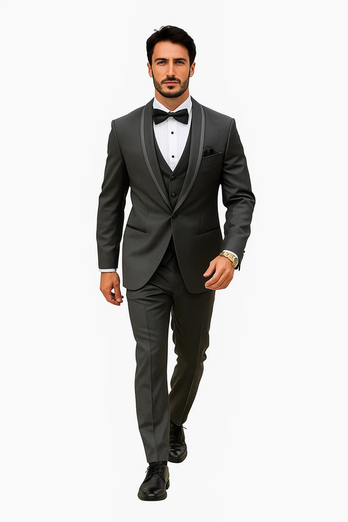 Charcoal satin tuxedo suit with shawl collar, five-button vest, and flat-front trousers. Tailored fit, smooth & glossy material. Includes a vest, white shirt, and black bow tie.