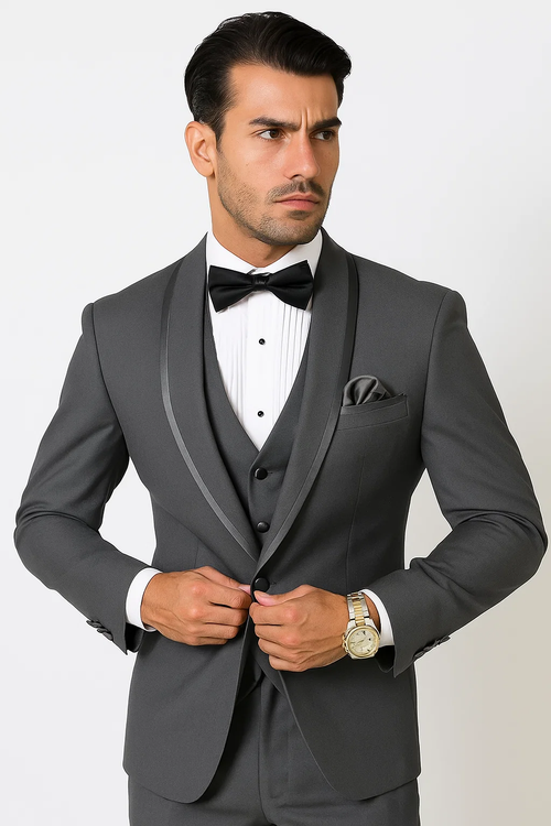 Charcoal satin tuxedo suit with shawl collar, vested. Single-breasted jacket, charcoal color, paired with a vest. Includes white pleated dress shirt, black bow tie, and matching pocket square.