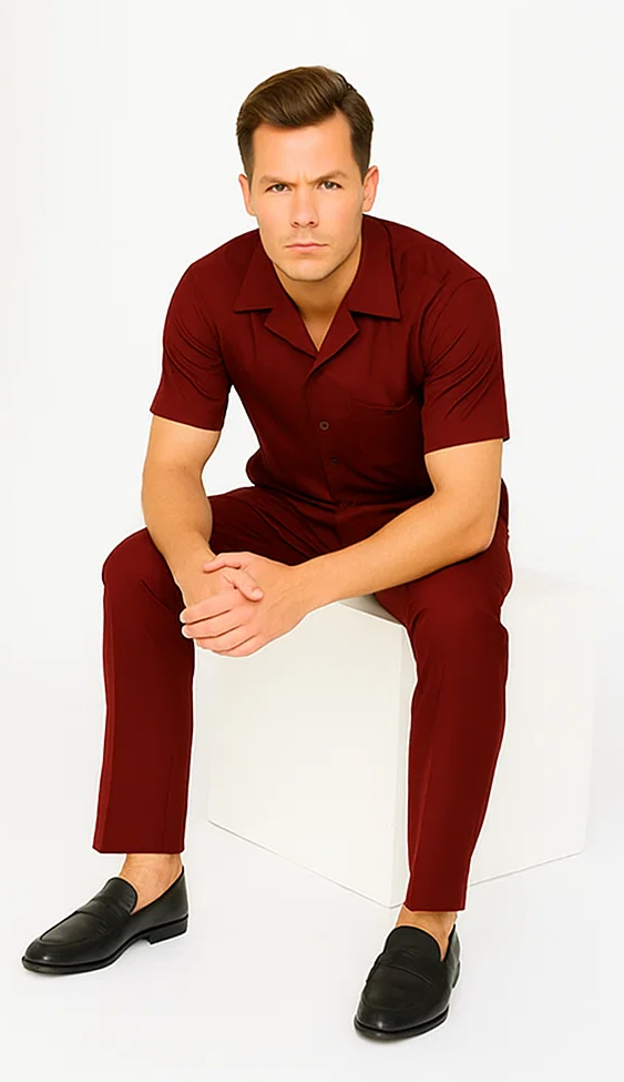 Burgundy leisure suit: short-sleeved button-up shirt and matching pants. Smooth fabric, tailored fit. Shirt has a single chest pocket.