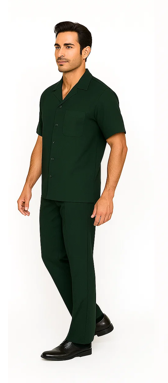 Hunter green men's walking suit. Short-sleeve button-up shirt with camp collar and chest pocket, paired with matching straight-leg pants. Lightweight, textured shirt, relaxed fit pants. Cohesive, stylish look.