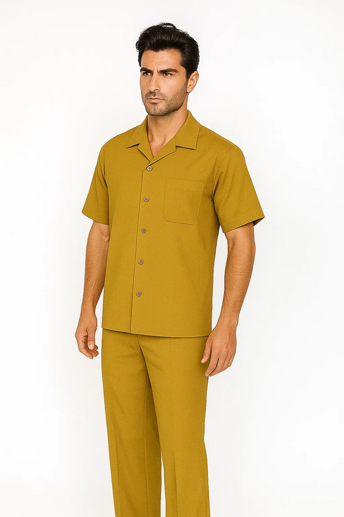 Mustard men's leisure suit: short-sleeved button-up shirt with chest pocket & 5 buttons. Matching straight-leg pants. Smooth, tailored fabric. Uniform mustard color.