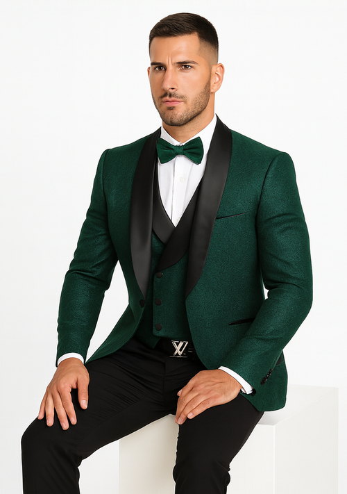 Hunter green designer tuxedo: fitted jacket with satin lapel, matching vest with floral lace, and black trousers. Bow tie included. Textured fabric.