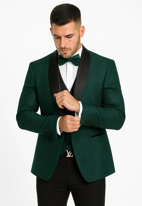 Hunter green tuxedo: Designer men's suit with floral lace vest, shawl collar, and bow tie. Textured fabric with black lapel accents and a tailored fit.