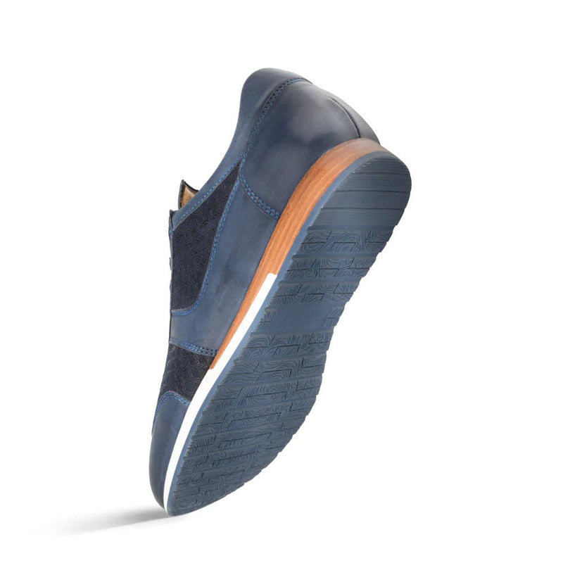 Blue Mezlan Maxim calfskin sneakers. Smooth and textured surfaces. Dark blue rubber sole with grooves. Brown heel accent.