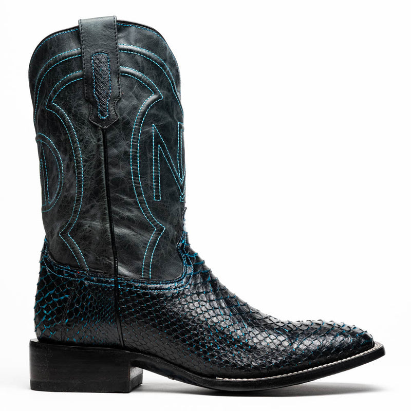 Marco Di Milano Missouri cowboy boots: black python vamp, blue-stitched black shaft, square toe, ornate ankle design, stacked heel. Offers structured design & stability.