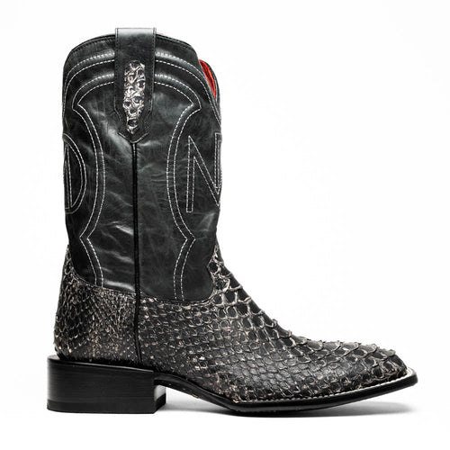 Marco Di Milano Missouri boots: Square toe, black leather upper with stitching, decorative pattern. Gray/white python skin lower, stacked heel. Structured, stylish cowboy design.