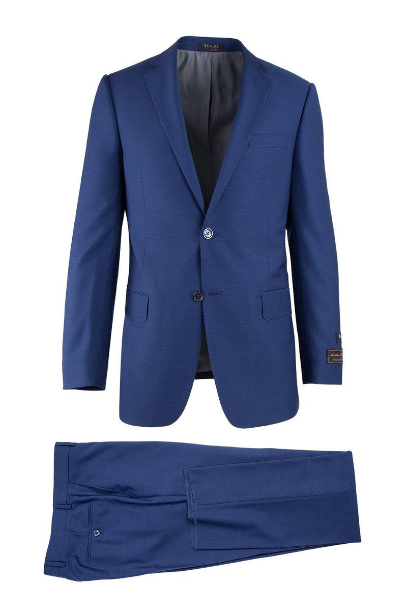 Tiglio Italian suit in solid blue. Tailored design with smooth fabric, narrow lapel blazer (two pockets) and flat-front trousers with single-button closure. Sleek, modern fit; no patterns.