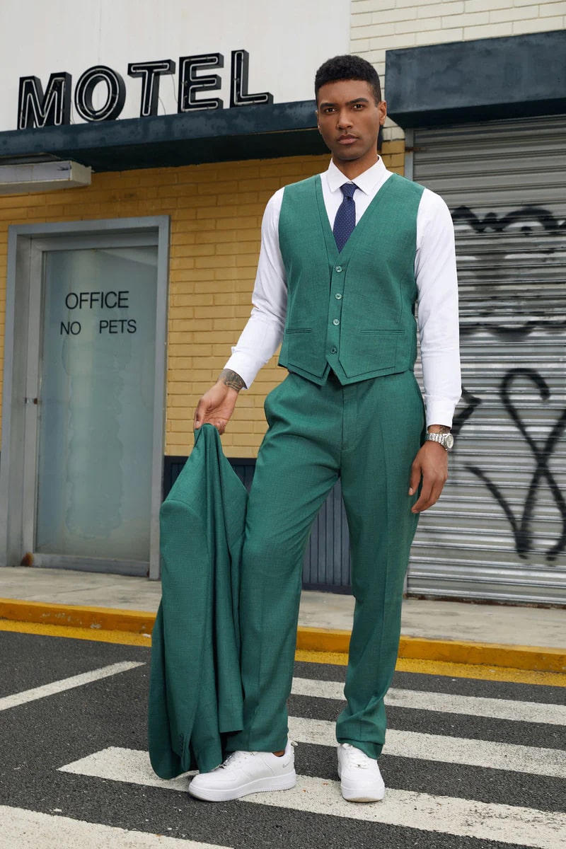 Men's neon teal green suit. Two-button jacket, vested, textured fabric. Matching tailored pants. Vibrant and stylish ensemble.