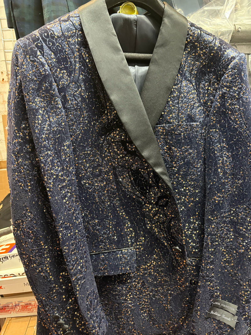 Navy sequin tuxedo jacket with black satin shawl lapel. Gold & silver sequin patterns, structured fit, and single-button closure. Perfect for making a statement!