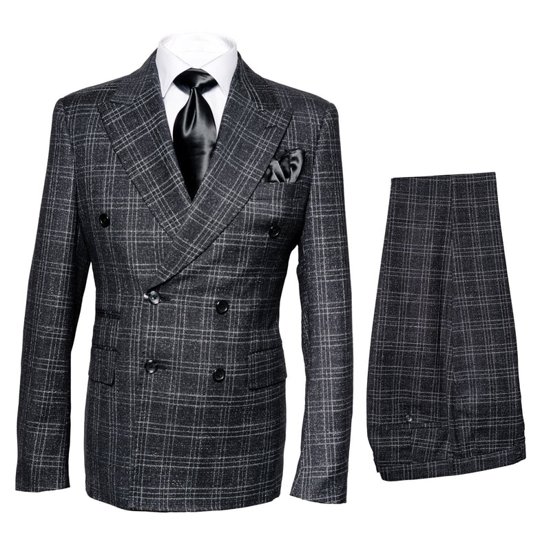 Charcoal plaid double-breasted men's suit. Structured blazer with notched lapels, button rows, and pockets. Matching trousers with a similar plaid pattern, tapering at the ankle. Gray grid design.
