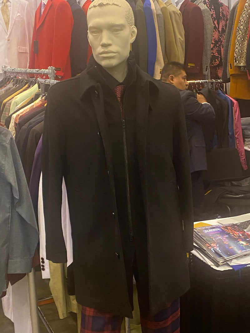 Men's black wool overcoat. Classic single-breasted design with button closure. Streamlined silhouette, lapel collar, and long sleeves. A timeless, versatile wardrobe staple.