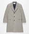 Men's grey herringbone long overcoat. Structured silhouette, notched lapel, button closure, and long sleeves. Features a grey herringbone pattern, two front pockets, and a black interior lining.