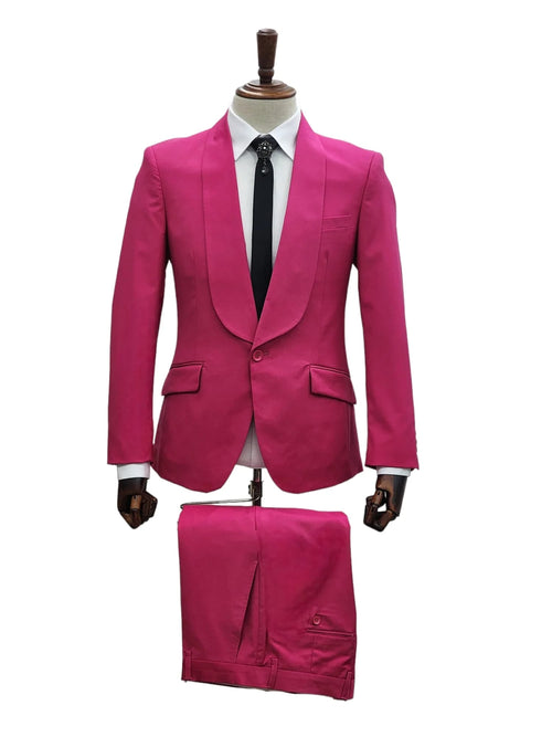 Men's hot pink tuxedo: shawl lapel jacket, fitted shape, two pockets. Matching bright pink pants, side pocket, seam detail. Bold formalwear.
