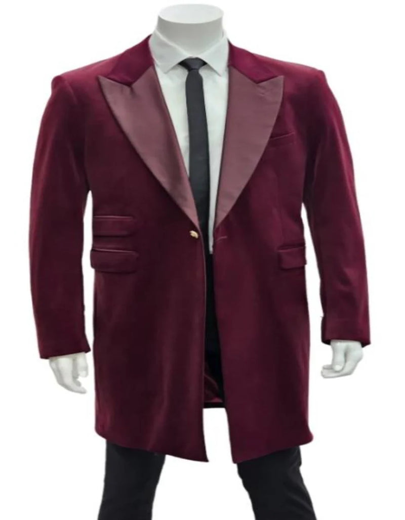 Men's burgundy tuxedo. Velvet long blazer with satin shawl collar, single-button closure, and two side pockets. Sleek, fitted silhouette.