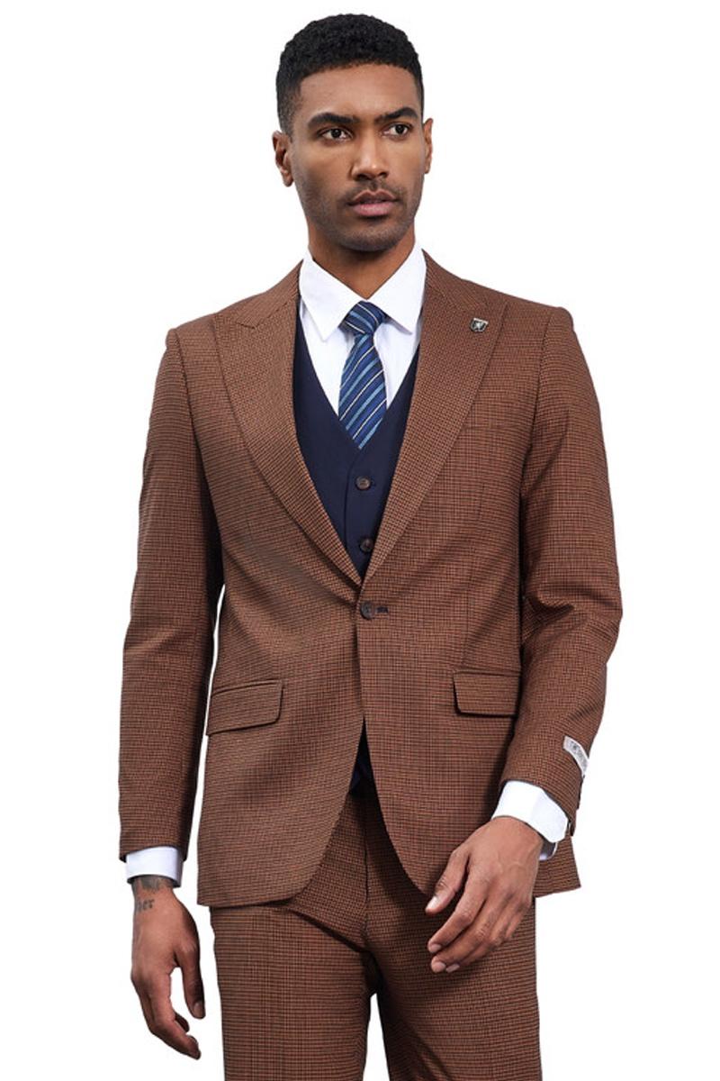 Cognac brown vested menswear suit with peak lapels & micro check pattern. Includes a navy vest underneath. Features two front pockets on the jacket.