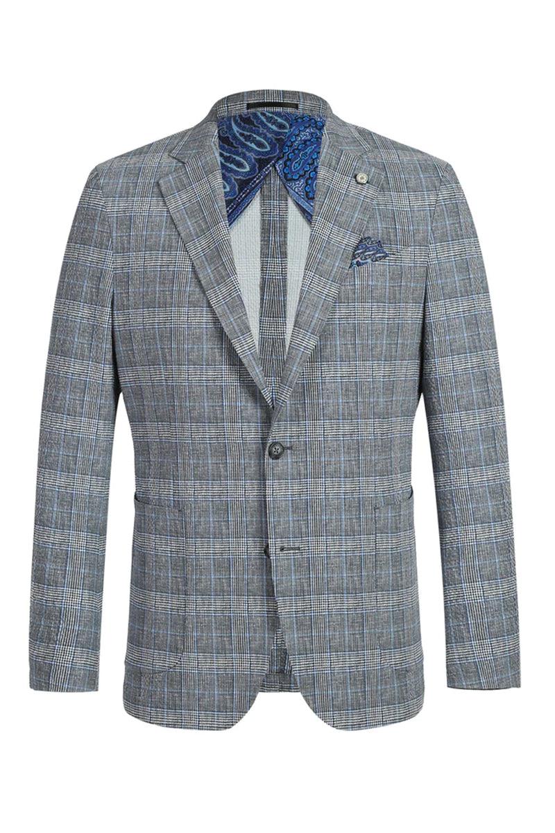 Men's slim fit, unconstructed summer blazer in grey-blue windowpane plaid. Lightweight fabric, two-button closure, notched lapel, and front pockets. Features a tailored yet relaxed silhouette with contrasting paisley lining at the collar.