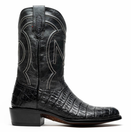 Marco Di Milano Phoenix cowboy boots. Black caiman crocodile leather, round toe. Intricate white stitching on shaft with decorative pattern. Block heel for stability.