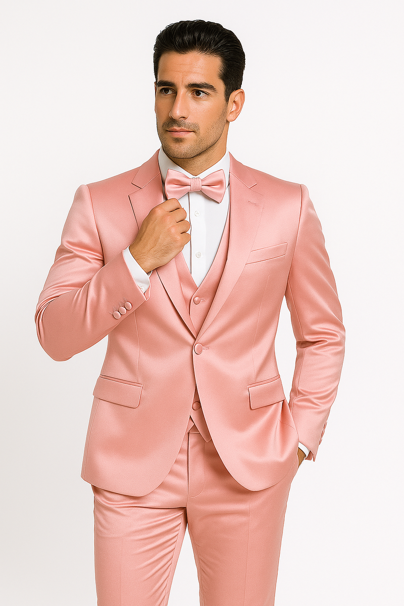 Alberto Nardoni's pink tuxedo set: fitted jacket (lapels, single button), matching pants, white dress shirt, and pink bow tie. Smooth, subtly shiny fabric for a formal look.
