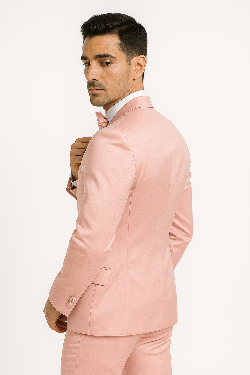 Pink Majesty tuxedo: fitted blazer with notch lapel, smooth fabric, structured silhouette, back vent. Matching pink trousers. Includes a coordinating bow tie for a formal look.
