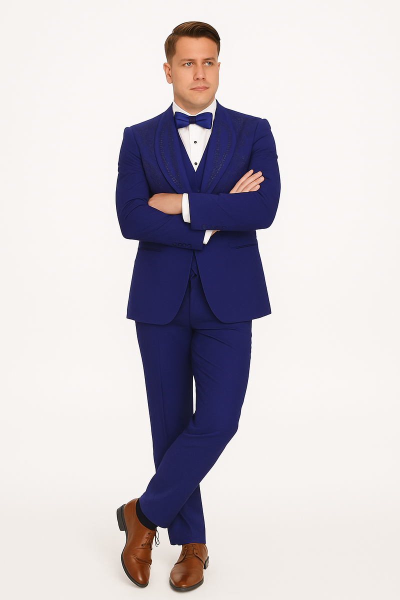 Royal blue Italian wool tuxedo: modern fit, three-piece. Tailored jacket with peaked lapels, matching trousers, and formal white shirt with bow tie.