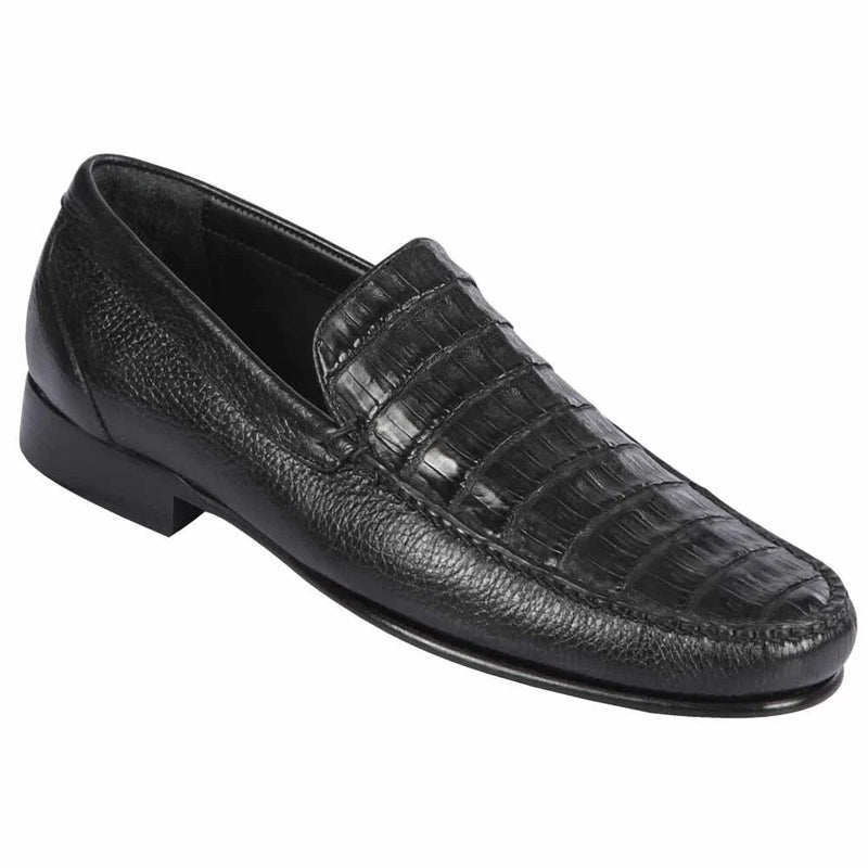 Men's black slip-on shoes with a low profile, rounded toe, and textured leather upper resembling crocodile skin. Features subtle stitching and a rigid black sole with a heel lift.