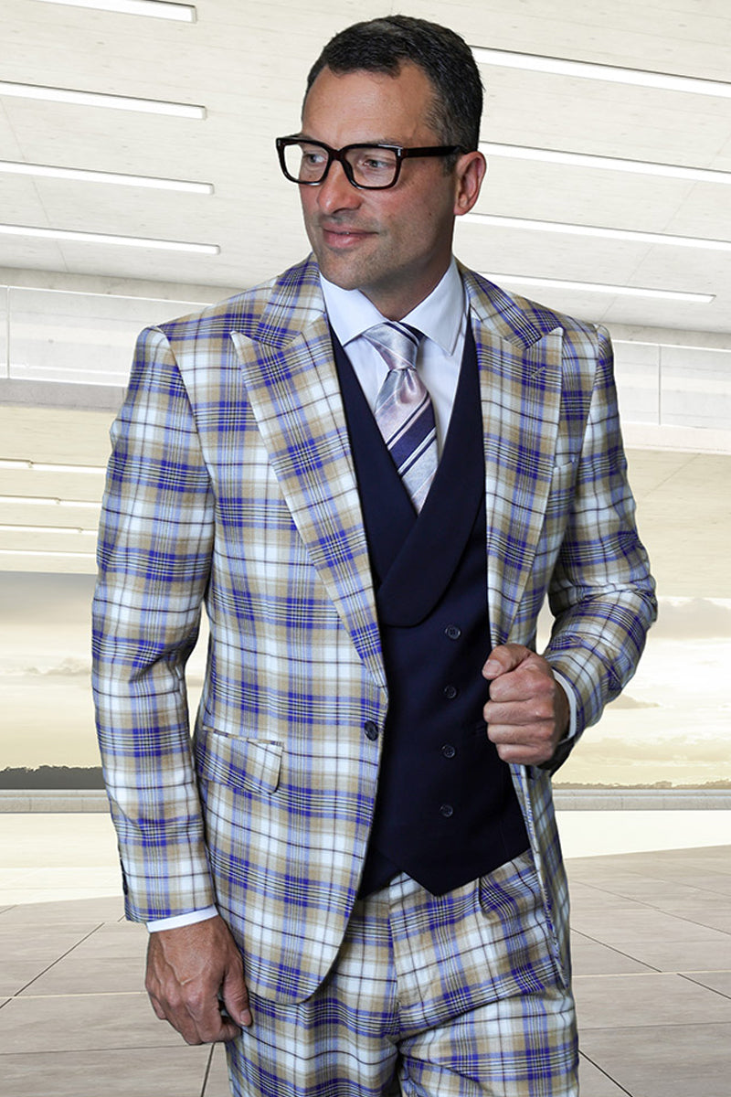 Sapphire blue plaid suit with peak lapels, Italian wool. Features a double-breasted vest. Colors: blue, beige, cream. Slim silhouette, structured shoulders. Jacket: one-button. Vest: six-button.

