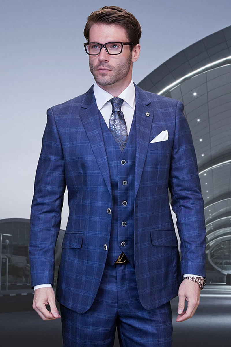 Men's indigo blue plaid suit. Modern fit, two-button blazer with pockets, and a five-button vest. Tailored trousers complete the look. Fitted silhouette, designer wool.
