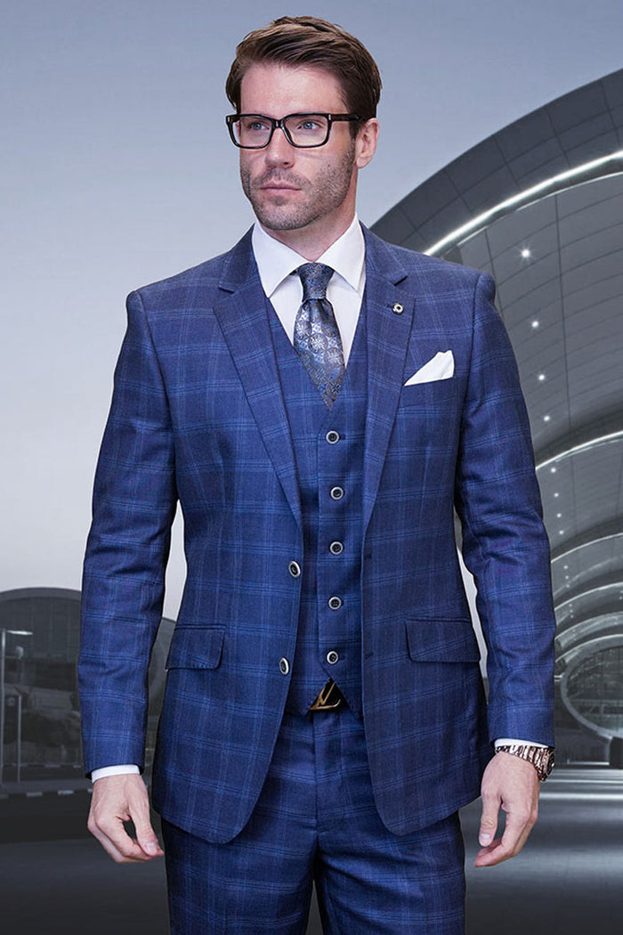 Men's indigo blue plaid suit. Modern fit, two-button blazer with pockets, and a five-button vest. Tailored trousers complete the look. Fitted silhouette, designer wool.
