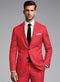 Red suit, black tie, tailored fit. Single-breasted jacket with two black buttons, two front pockets. Smooth texture. Includes white dress shirt.
