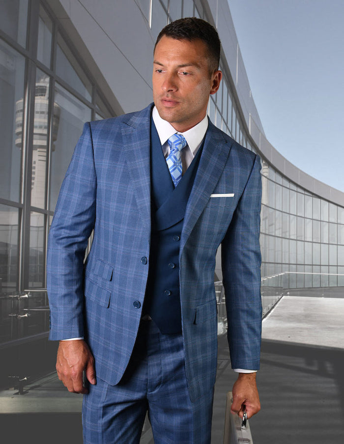 Men's indigo blue plaid 2-button suit with wide peak lapels. Includes a dark blue vest. Features a tailored, fitted silhouette with matching flat-front pants.