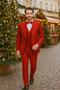 Alberto Nardoni red wool tuxedo. Modern fit, 3-piece suit with tailored jacket, fitted waistcoat & slim trousers. Includes white shirt & red bow tie. Italian fabric, subtle jacket detailing.